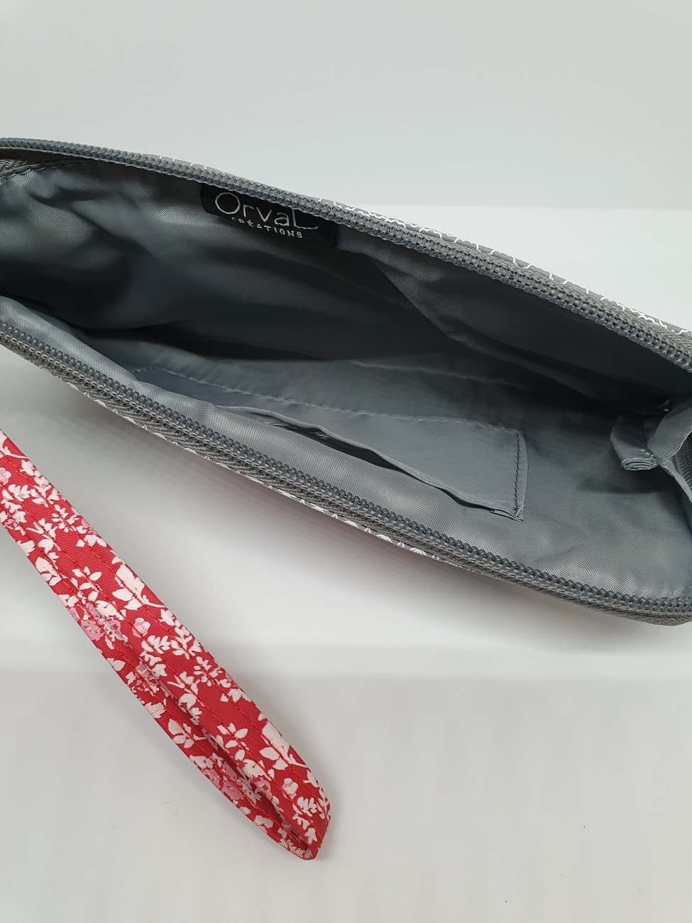 Pochette porta documenti con laccio da polso fantasia Fiocco Orval